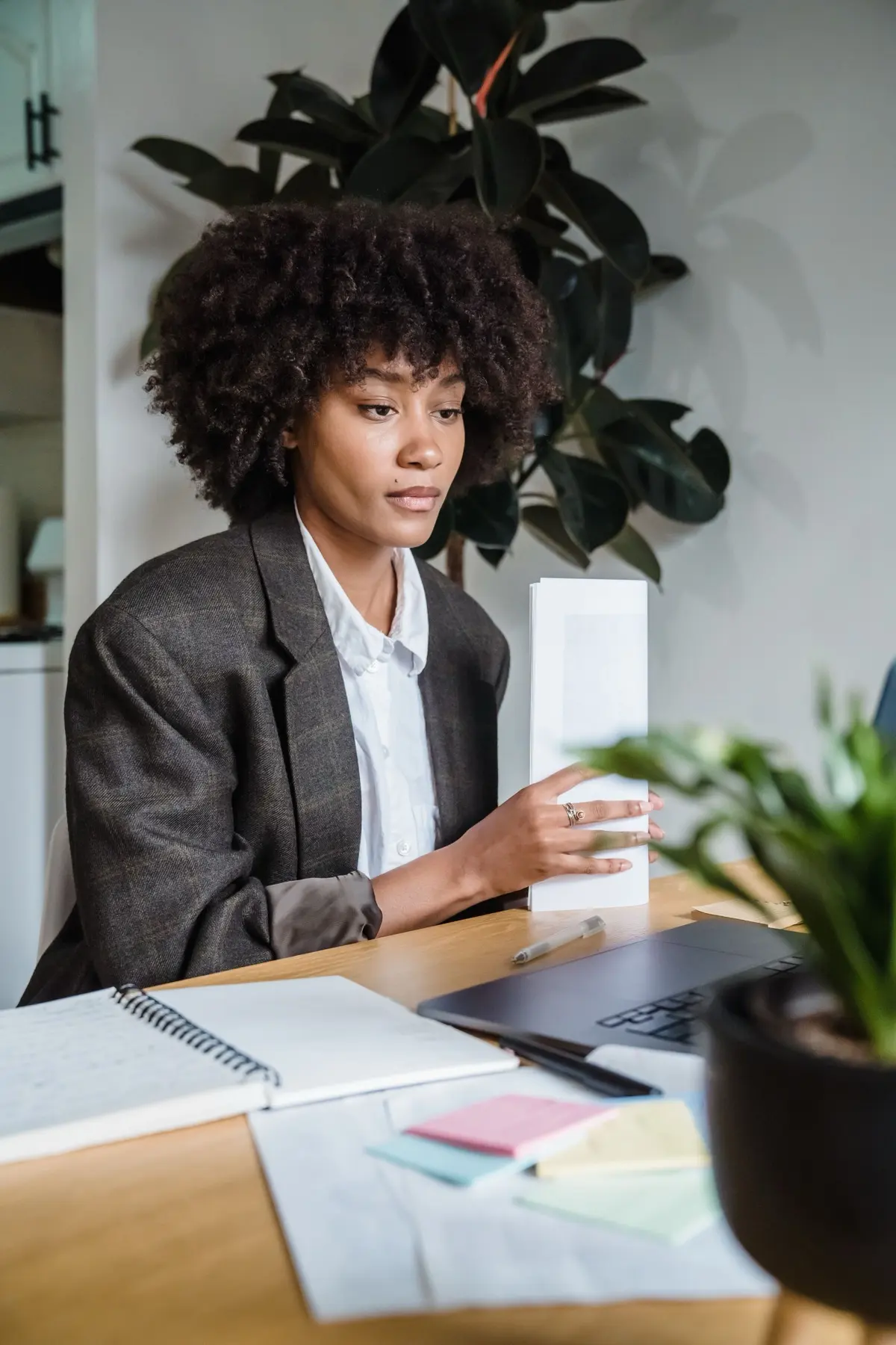 An actuary reviewing a model's change history at her desk.